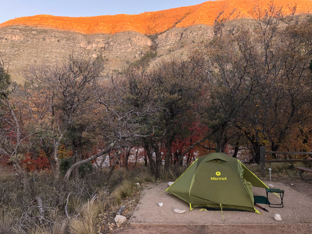 My tent at campsite #6 with the setting sun hitting the top of Dog Canyon in the background.